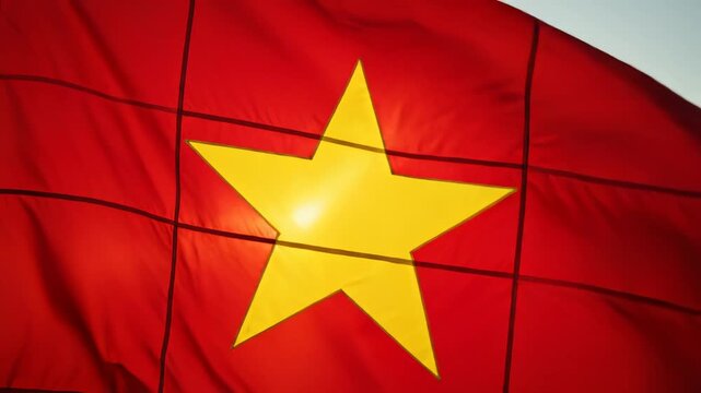Red flag with yellow star waving