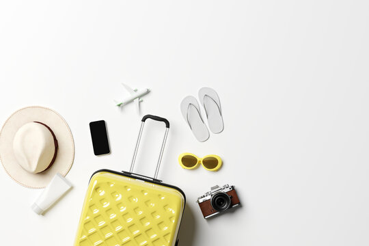 Travel accessories with suitcase on minimal white background