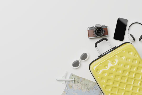 Travel accessories with suitcase on minimal white background