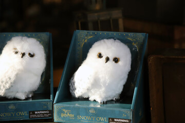 Naklejka premium Hedwig the owl toys from Harry Potter are on sale in a store