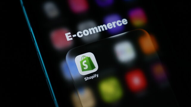 Shopify app icon on a smartphone screen, representing ecommerce and online retail business platform