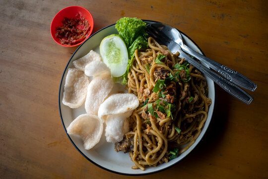 Bakmi Goreng, an Indonesian traditional street food, fried noodles cooked with spices typical of Javanese cuisine