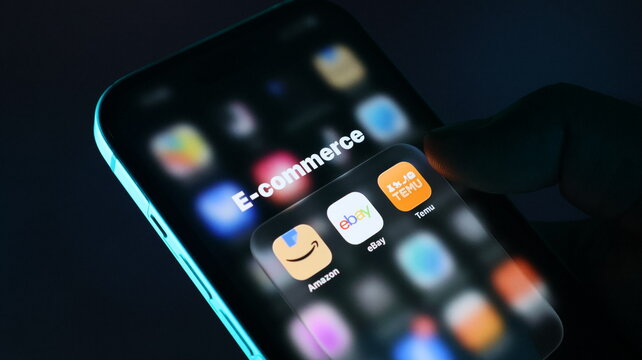 Closeup of a smartphone screen displaying popular ecommerce mobile applications including amazon, ebay, and temu icons
