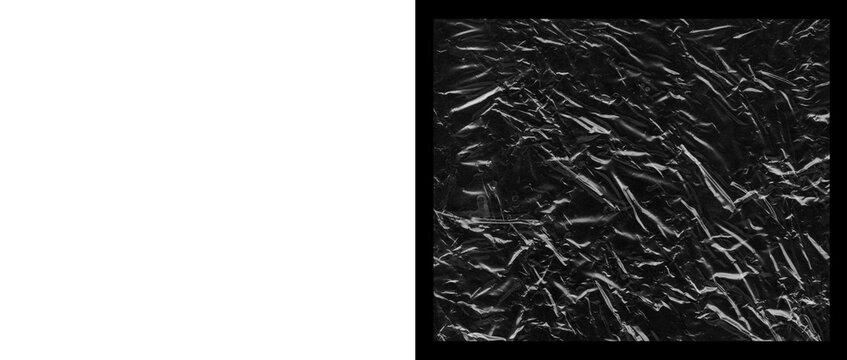 Crumpled black paper texture, wrinkled dark foil surface background, abstract creased charcoal material with dramatic highlights and shadows