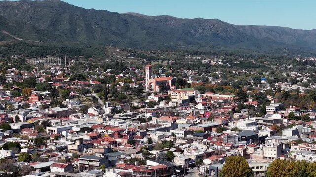Aerial drone shot of La Falda city in the scenic Punilla Valley, Cordoba, Argentina.