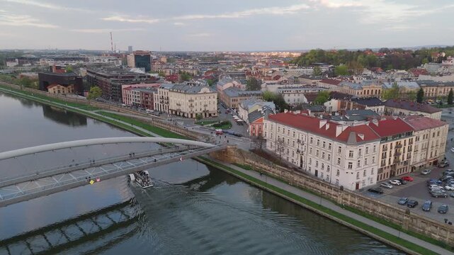 Aerial flyover of Krakow's Old Town and the Vistula River in the evening in spring