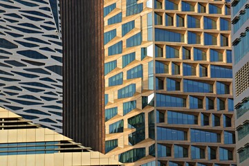 Fototapeta premium Abstract architectural background of modern skyscraper facades with geometric patterns in KAFD Riyadh
