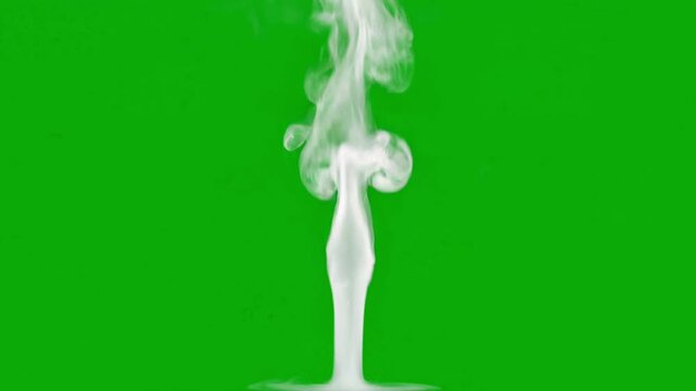 White vapor smoke plume rising vertically and swirling on a solid chroma key green screen background