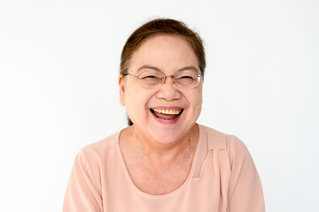 Fototapeta premium Joyful elderly woman smiling brightly.