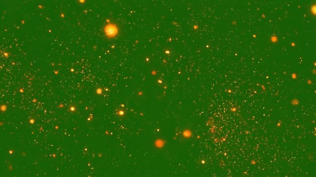 Glowing orange fire ember particles floating and swirling across a vivid chroma key green screen background