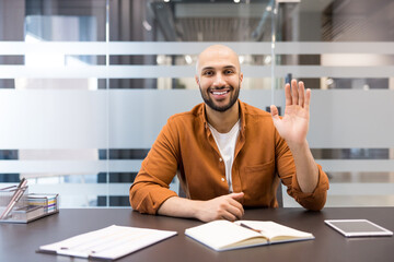 Fototapeta premium Successful businessman greeting during online video conference