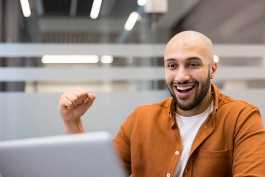 Excited man celebrating online success receiving good news