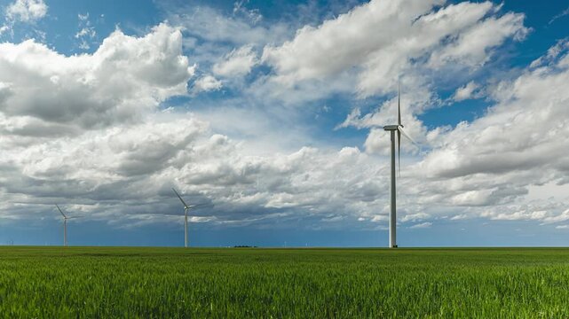 Beautiful Green Fields With Wind Turbines and Moving Clouds Timelapse
