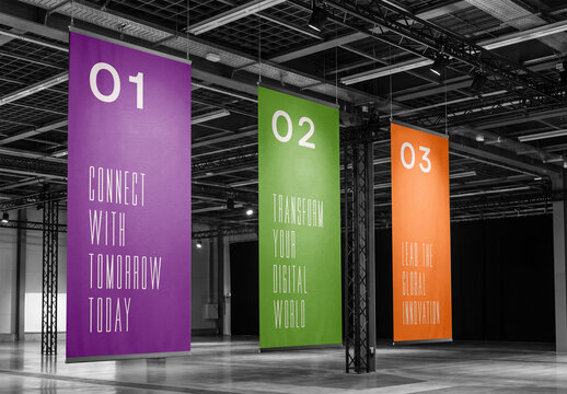 Three vertical hanging poster banners mockup in a large industrial exhibition hall or conference event center interior background