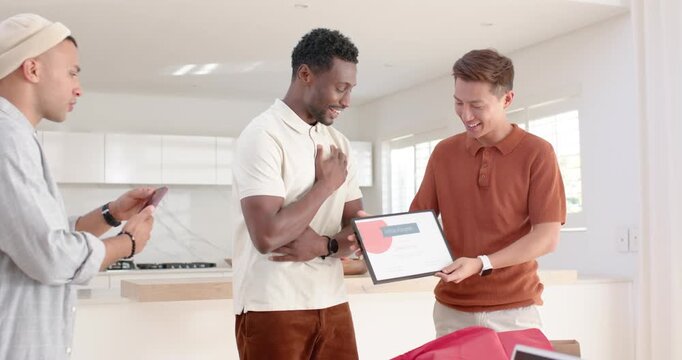 Diverse male friends in kitchen center man accepting award as right giving, left shooting on phone