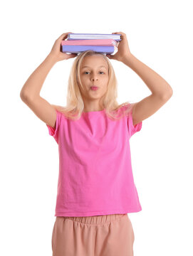 Happy teenager girl with books blowing kiss on white background