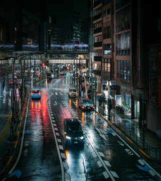 Tokyo, Japan: rainy night at Shibuya intersection