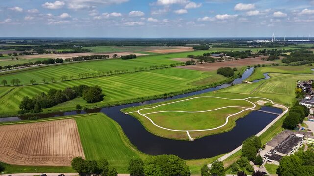 Aerial view flying over a dutch park and rural landscape