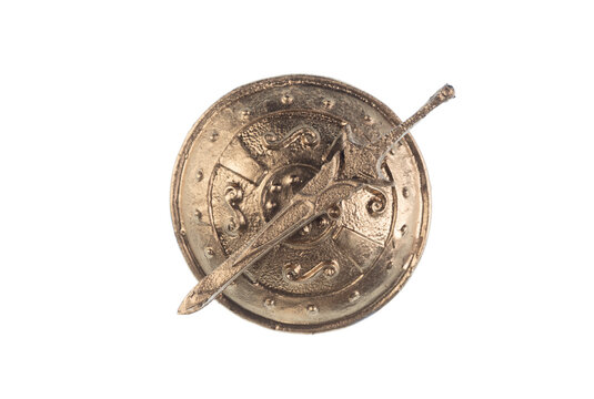 golden knight's shield and sword on white background