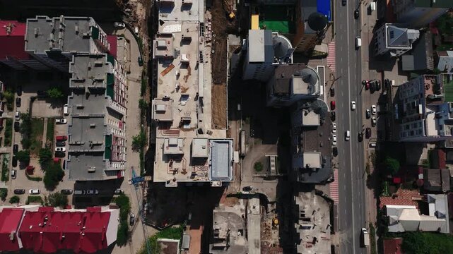 Top down drone view of rooftop pool on residential building under construction
