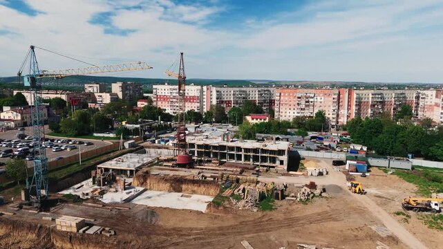 Dynamic aerial parallax shot over large concrete construction site