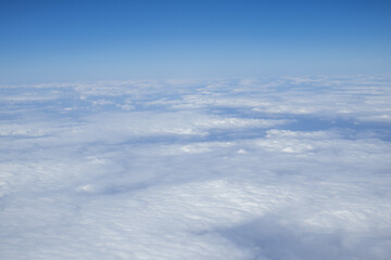 Naklejka premium Soft White Clouds Viewed From Airplane Above The Sky During Flight
