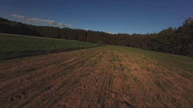FPV Drone Aerial View Over Agricultural Fields and Forest Near Nowy Lu