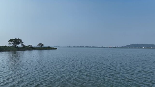 , A drone-captured view of Deepor Beel, Assam, showcasing water-filled wetlands surrounded by natural beauty, offering a serene and picturesque environment rich in ecological charm.4k