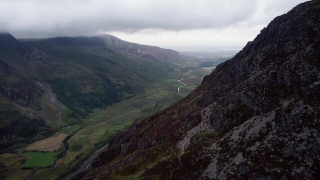 Stormy Mountain Valley Framed by Rocky Cliffs, Snowdonia