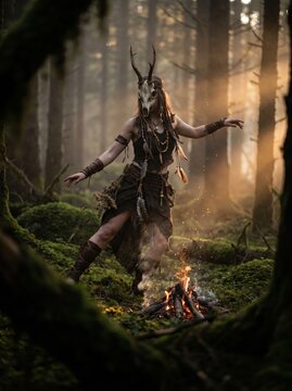 caucasian woman wearing deer skull mask dancing around campfire in misty mossy forest. pagan ritual and tribal shamanic ceremony. mystical fantasy illustration, book cover, poster.