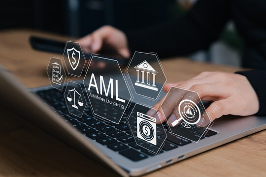 AML Anti-Money Laundering concept. business person typing on laptop interacting with digital icons of financial law, fraud protection, compliance, regulations, transaction screening, crime prevention,