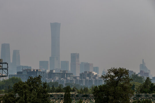 Skyscrapers and buildings shrouded in smog. Heavy air pollution in Beijing - China. Beijing Dontown (CBD) and China Zun