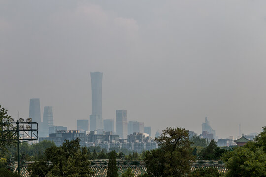 Skyscrapers and buildings shrouded in smog. Heavy air pollution in Beijing - China. Beijing Dontown (CBD) and China Zun