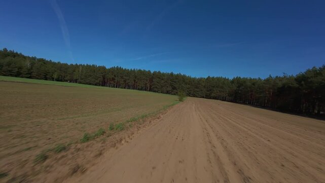 FPV Drone Flight Over Agricultural Fields with Forest Edge