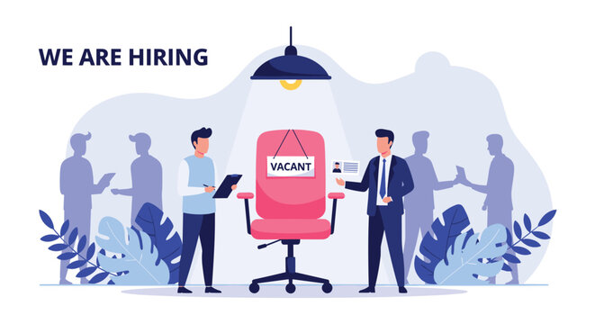 Hiring manager and applicant standing near a vacant office chair with a sign in a busy company office interior.