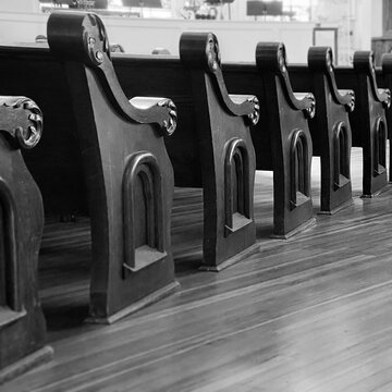 Antique Rows of Church Pews on Hardwood Floor Black and White