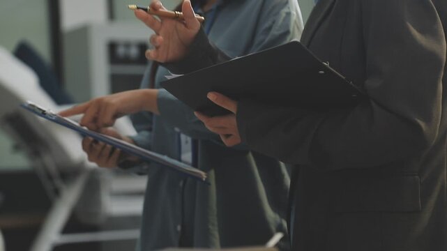 Auditor and accountant working in office Analyze financial data and accounting records with a calculator. Accounting companies provide financial and tax planning services. Close-up pictures