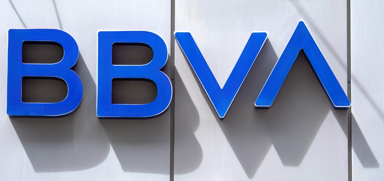 BBVA bank logo mounted on modern building facade with blue corporate lettering