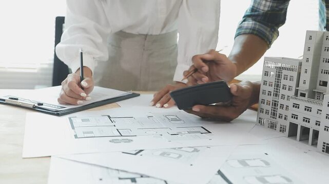 The real estate agent closes the deal with the client and they sign the contract.