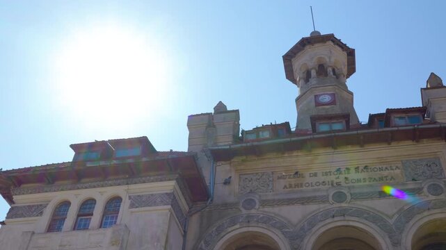 History and archaeology museum building in constanta romania. Majestic facade of the historic national museum of history and archeology in constanta, romania, with its ornate details and clock tower