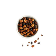 Fototapeta premium Dried Sichuan peppercorns with reddish-brown husks and black seeds isolated on white background