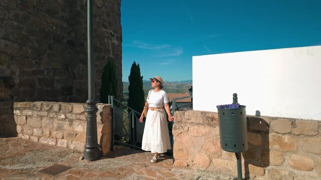 Woman Explores Ancient Spanish Village Peal De Becerro with Mountain Views