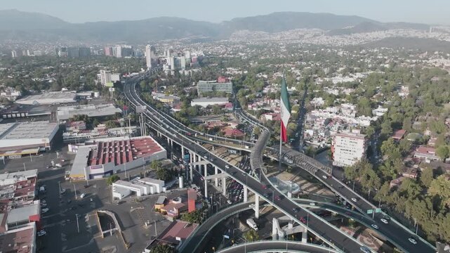 Aerial panoramic view of San Jeronimo highway interchange and monumental Mexican flag in Mexico City