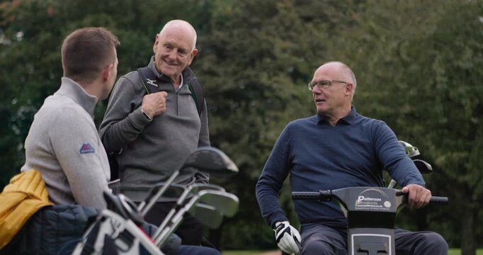 Friends, senior men or cart at golf course with conversation, equipment and bag outdoor on grass field. Golfers, old people or man in wheelchair in nature for sport, golfing or recreation for fitness