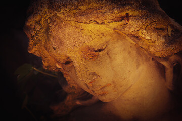 Obraz premium Mystical ancient angel glowing in warm golden light.