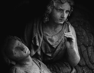 Obraz premium Angel of death leads human in the last path. Death concept. Fragment of an ancient statue.