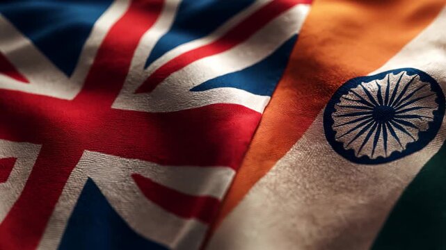 british flag waving next to indian flag. relations great britain and india