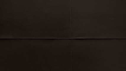 Fototapeta premium Dark brown textured leather desktop wallpaper with subtle seams.