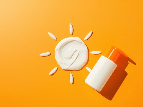 Creative sunscreen flat lay on bright orange background