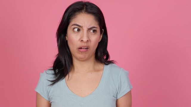 Expressive woman making funny and strange grimaces